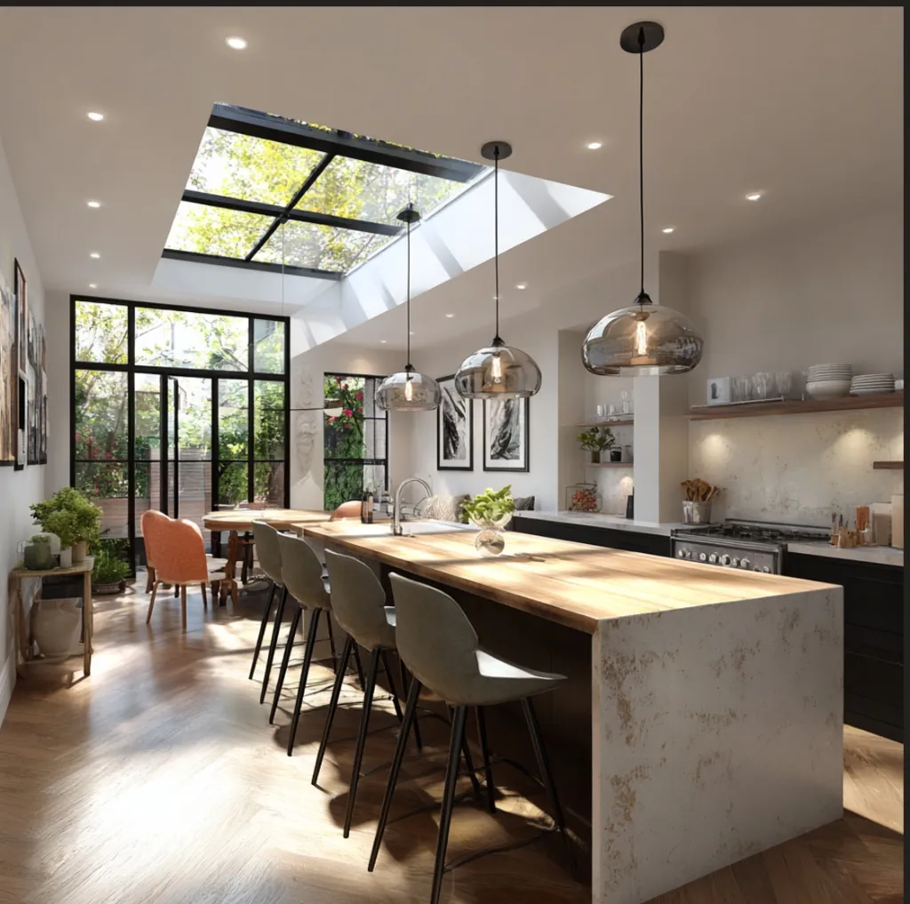 Large glass roof lights and modern kitchen island in a stunning Hampstead house extension