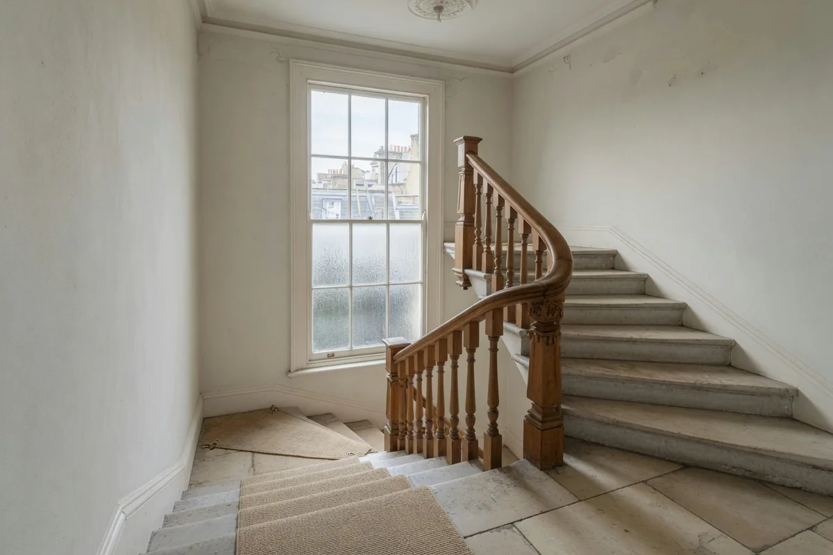 Oak stair and a sash window in a St John's Wood house